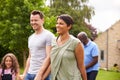 Smiling Multi-Generation Mixed Race Family In Garden At Home Together Royalty Free Stock Photo