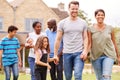 Smiling Multi-Generation Mixed Race Family In Garden At Home Together Royalty Free Stock Photo