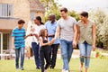 Smiling Multi-Generation Mixed Race Family In Garden At Home Together