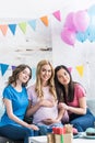 smiling multicultural friends and pregnant woman Royalty Free Stock Photo