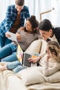 smiling multicultural teenagers looking at laptop Royalty Free Stock Photo