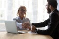 Smiling multiethnic businesspeople handshake greeting at meeting Royalty Free Stock Photo