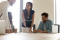 Smiling multiethnic employees have fun brainstorming at meeting Royalty Free Stock Photo