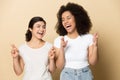 Smiling multiracial girlfriends cross fingers make wish Royalty Free Stock Photo