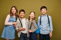 Smiling multiethnic kids with backpacks in Royalty Free Stock Photo