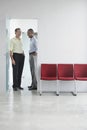 Smiling Multiethnic Men In Office Doorway