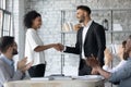 Smiling multiracial businesspeople handshake in office meeting Royalty Free Stock Photo