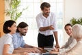 Smiling multiracial colleagues brainstorm at office meeting Royalty Free Stock Photo