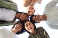 Smiling multiracial friends forming circle of heads Royalty Free Stock Photo