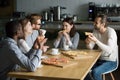 Smiling multiracial friends talking drinking coffee eating pizza Royalty Free Stock Photo