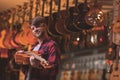 Smiling musician with a ukulele indoors