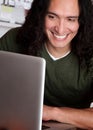 Smiling Native American Man Working on a Laptop