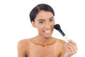 Smiling natural model using blusher brush Royalty Free Stock Photo