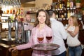 Smiling nippy with beverages