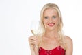 Smiling nordic girl holding a glass of white wine