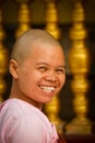 A Smiling Nun of Shwedagon Pagoda, Yangon, Myanmar