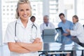 Smiling nurse with arms crossed Royalty Free Stock Photo