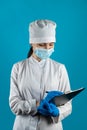 smiling nurse with beautiful smile holding a clipboard isolated on a plain background Royalty Free Stock Photo