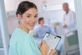 Smiling nurse holding clipboard Royalty Free Stock Photo