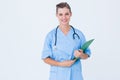 Smiling nurse holding clipboard Royalty Free Stock Photo