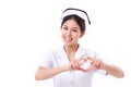 Smiling nurse making heart symbol hand gesture