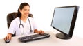 Smiling Nurse Sitting at her Desk