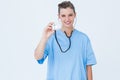 Smiling nurse using stethoscope Royalty Free Stock Photo