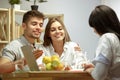 Smiling nutritionist showing a healthy diet plan to patient