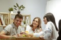 Smiling nutritionist showing a healthy diet plan to patient