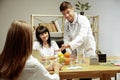 Smiling nutritionists showing a healthy diet plan to patient