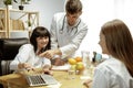 Smiling nutritionists showing a healthy diet plan to patient