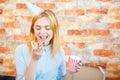 Smiling office lady, at lunchtime and eating pizza. Festive atmosphere. Royalty Free Stock Photo