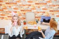 Smiling office lady, at lunchtime and eating pizza. Festive atmosphere. Royalty Free Stock Photo