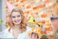 Smiling office lady, at lunchtime and eating pizza. Festive atmosphere. Royalty Free Stock Photo