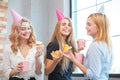 Smiling office lady, at lunchtime and eating pizza. Festive atmosphere. Royalty Free Stock Photo