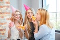 Smiling office lady, at lunchtime and eating pizza. Festive atmosphere. Royalty Free Stock Photo