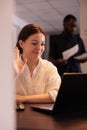 Smiling office manager greeting colleague on online meeting, telecommute