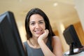 Smiling office worker in front of computer Royalty Free Stock Photo