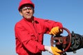 Smiling Oil Worker Turning Valve On Oil Rig Royalty Free Stock Photo