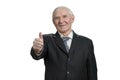 Smiling old businessman with thumb up. Royalty Free Stock Photo