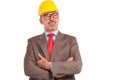 Smiling old construction engineer looking up to his side Royalty Free Stock Photo