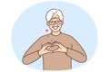 Smiling old man show heart symbol feel grateful