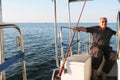 Smiling old sailor on yacht in Cherkassy city, Ukraine, August 2020. Cruise travelling active old man wallpaper. Sailing sport