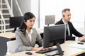 Smiling operator asian woman customer service agent working on computer in call center Royalty Free Stock Photo