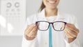 Banner background with an optician holding new eyeglasses and giving them to you Royalty Free Stock Photo