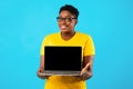 Oversized Black Woman Holding Laptop With Blank Screen, Blue Background Royalty Free Stock Photo