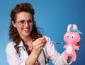 Paediatrician doctor giving a spoon of childrens suspension Royalty Free Stock Photo