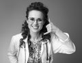 Smiling paediatrist woman showing call me gesture on Royalty Free Stock Photo