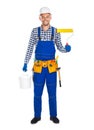 Smiling painter with paint roller and bucket isolated on white b Royalty Free Stock Photo