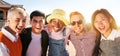 Smiling panoramic portrait of cheerful group of young people. Happy friends excited having fun. Interracial Royalty Free Stock Photo